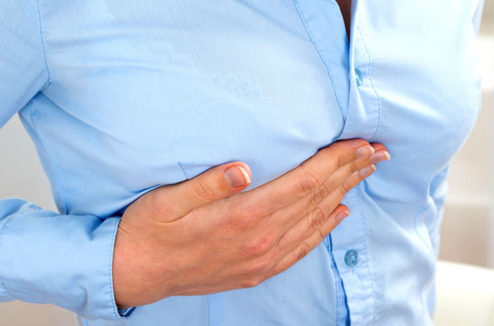 почему болит грудь в середине цикла